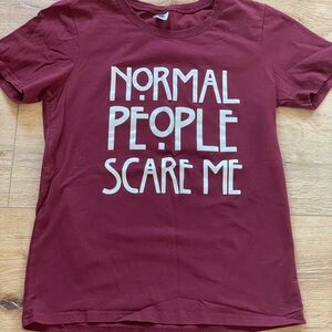 Women’s graphic tee with Normal People Scare Me print on front. Size S.